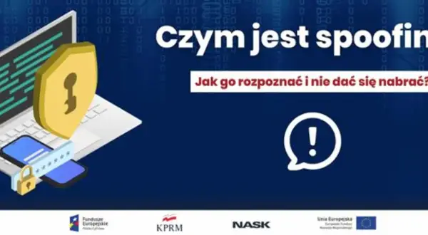 Grafika przedstawia laptopa z tarczą ochronną i telefonem, symbolizując bezpieczeństwo. Tekst pyta "Czym jest spoofing?" i jak go rozpoznać, by się nie dać nabrać.